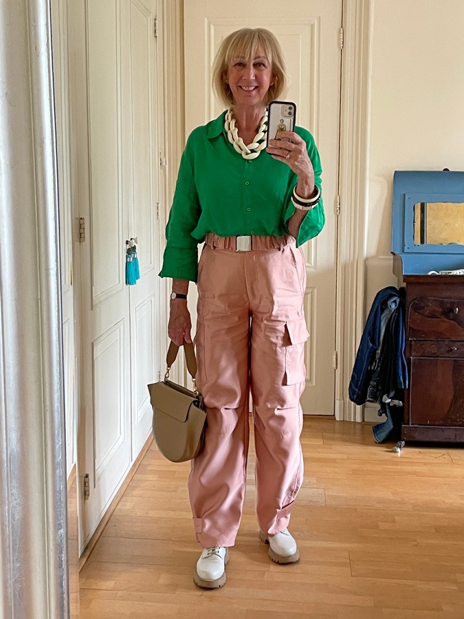 Pink cargo trousers with a green shirt