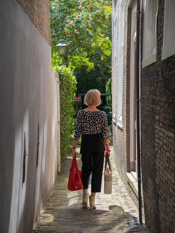 Black summer trousers with a black and white jumper