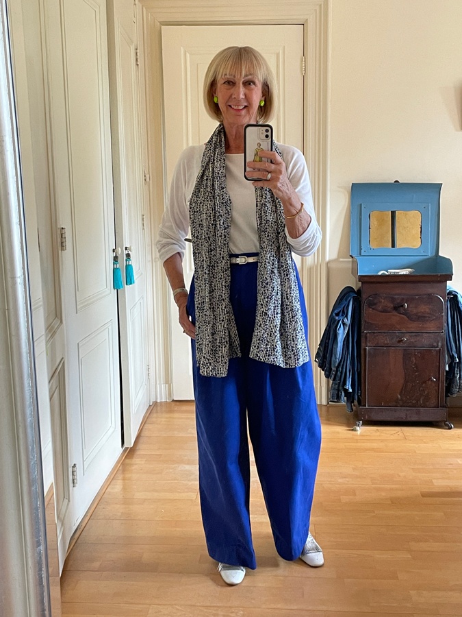 Blue trousers with a blue, white and yellow scarf