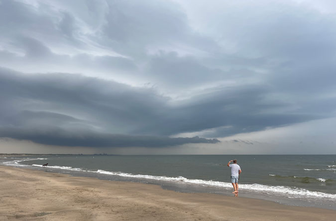 Walking the dog at the beach with rain threatening