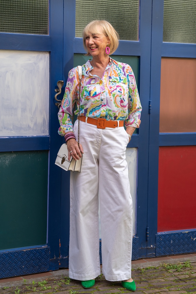 White wide leg trousers with a colourful shirt