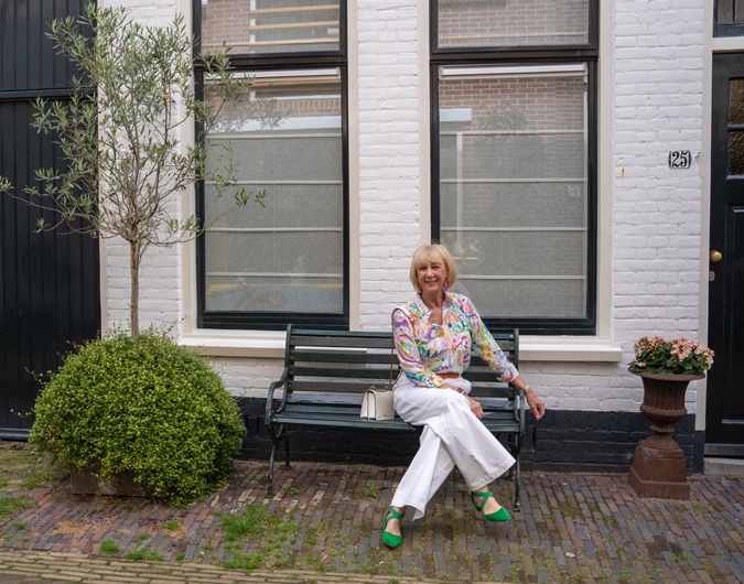 White wide leg trousers with a colourful shirt