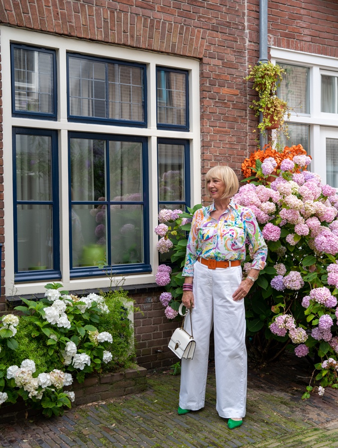 White wide leg trousers with a colourful shirt