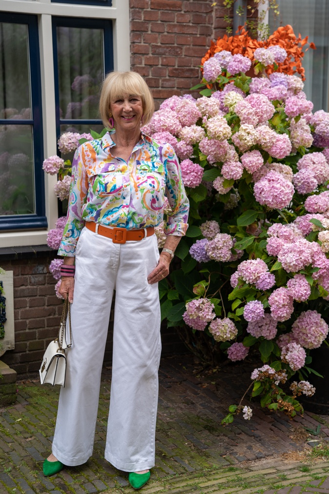 White wide leg trousers with a colourful shirt