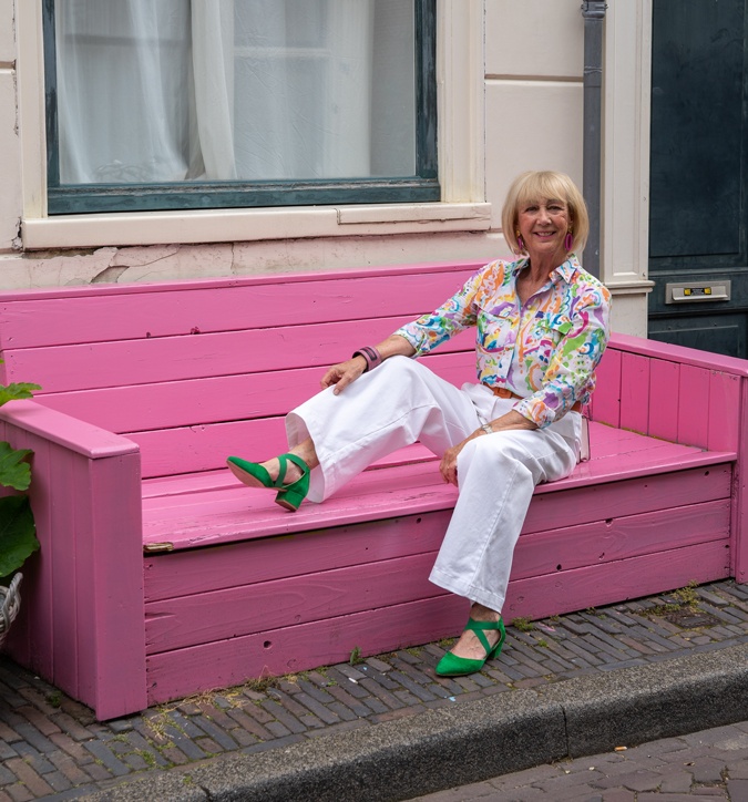 White wide leg trousers with a colourful shirt