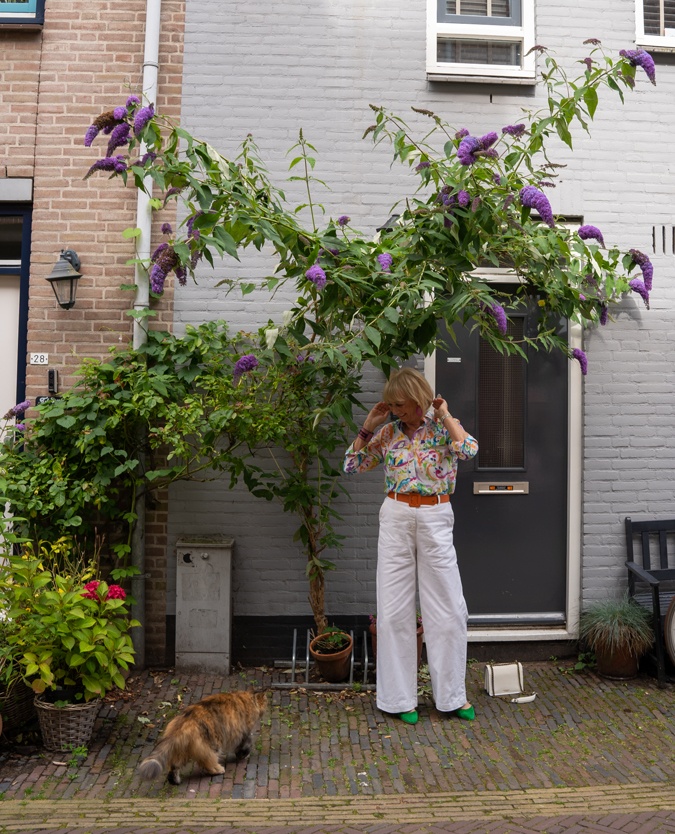 White wide leg trousers with a colourful shirt