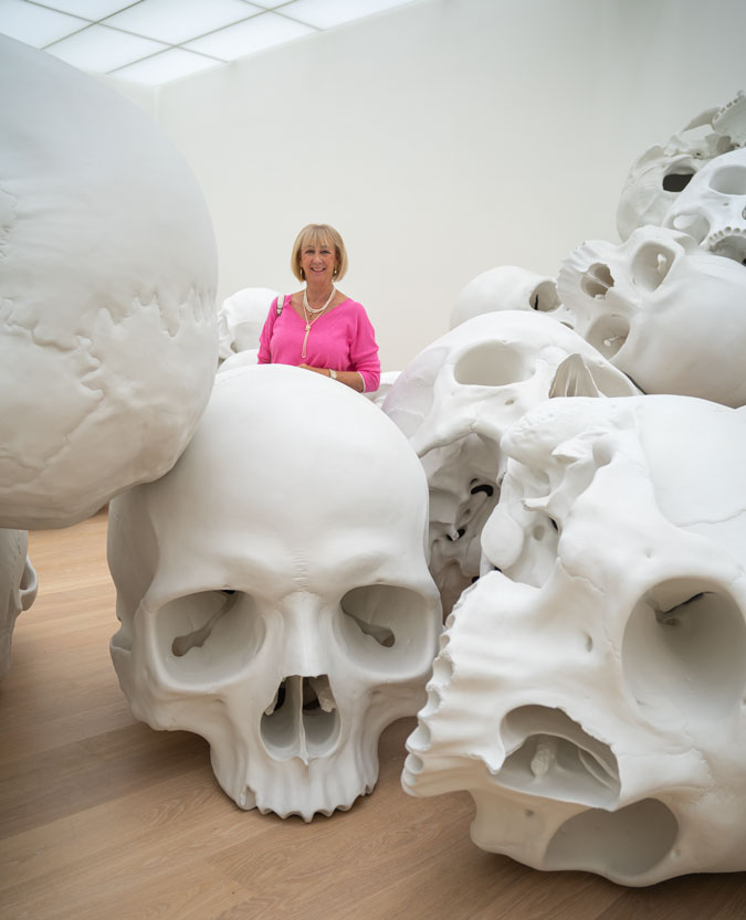 Bright blue trousers with a pink top and Ron Mueck