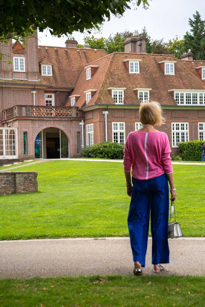 Bright blue trousers with a pink top