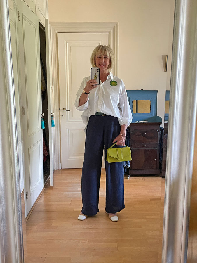 wide blue trousers with a wide white shirt